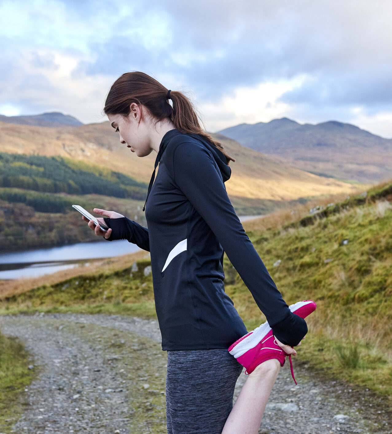 Female runner stretching