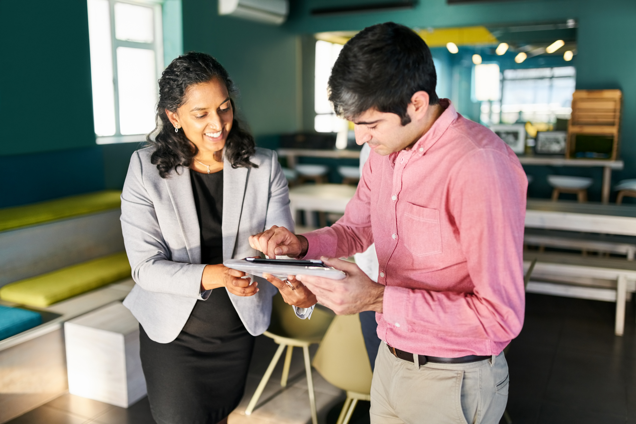 Businessman signing a rental agreement with a Real Estate Agent in an new office